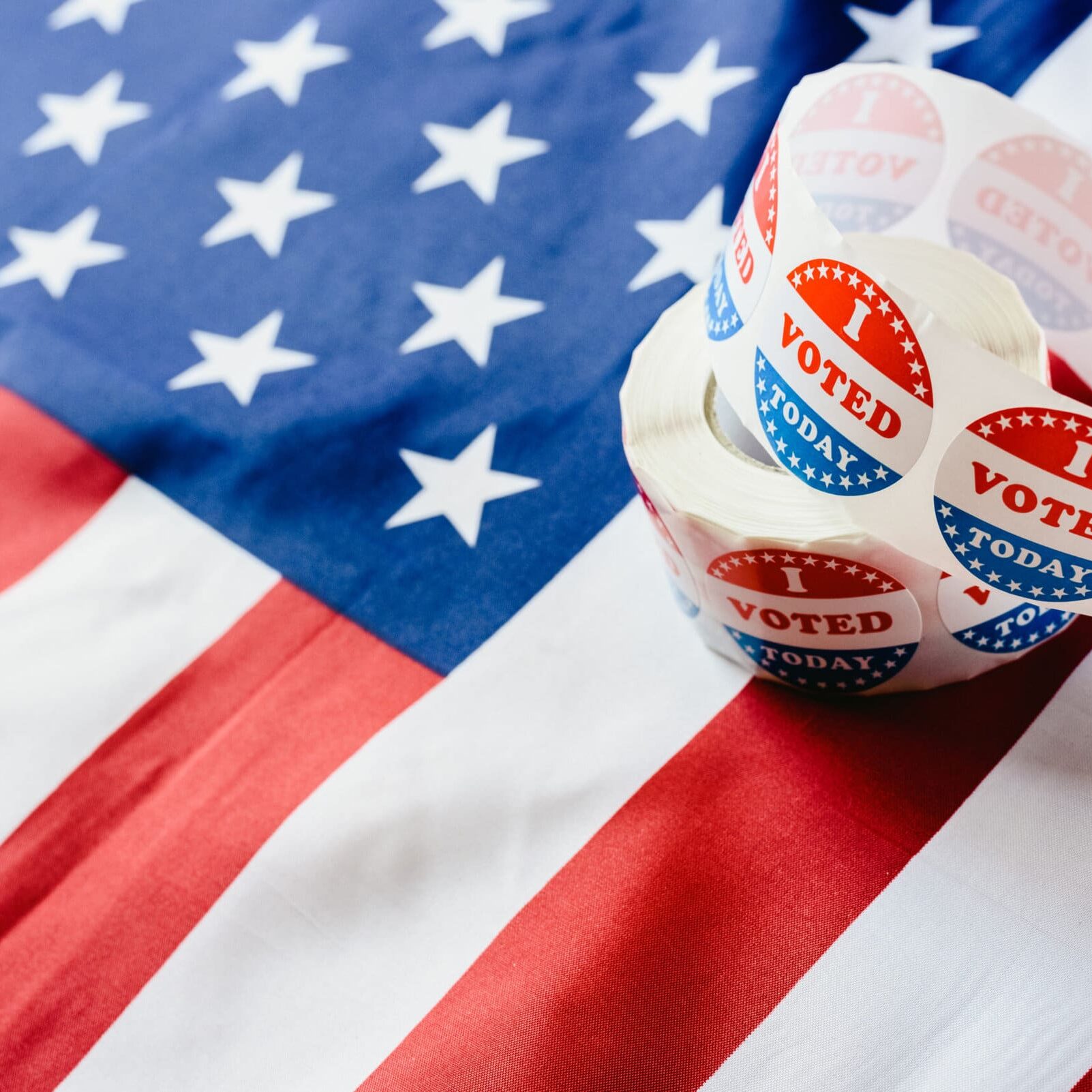American flag with vote today stickers